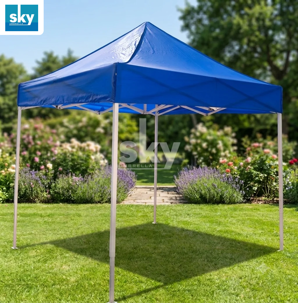 A blue pop-up canopy tent with white support legs set up on a green lawn in a garden. Adjustable Height and Premium Quality