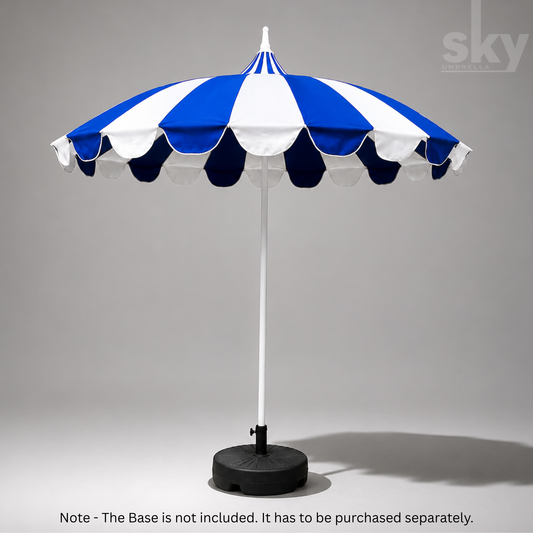 A blue and white striped patio umbrella with a scalloped edge and a white pole, shown on a gray background. A note at the bottom states that the base is not included and must be purchased separately.