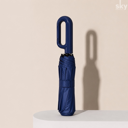 A folded dark blue umbrella with a unique U-shaped handle which is auto open and close for convenient use.