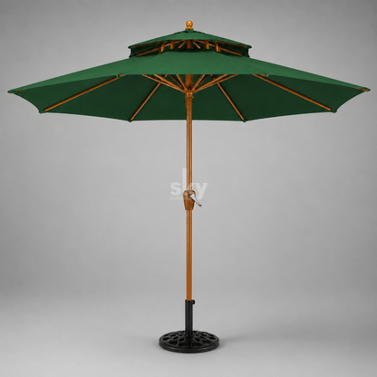 A green patio umbrella with a wooden pole finish and black metal base, shown against a neutral gray background.