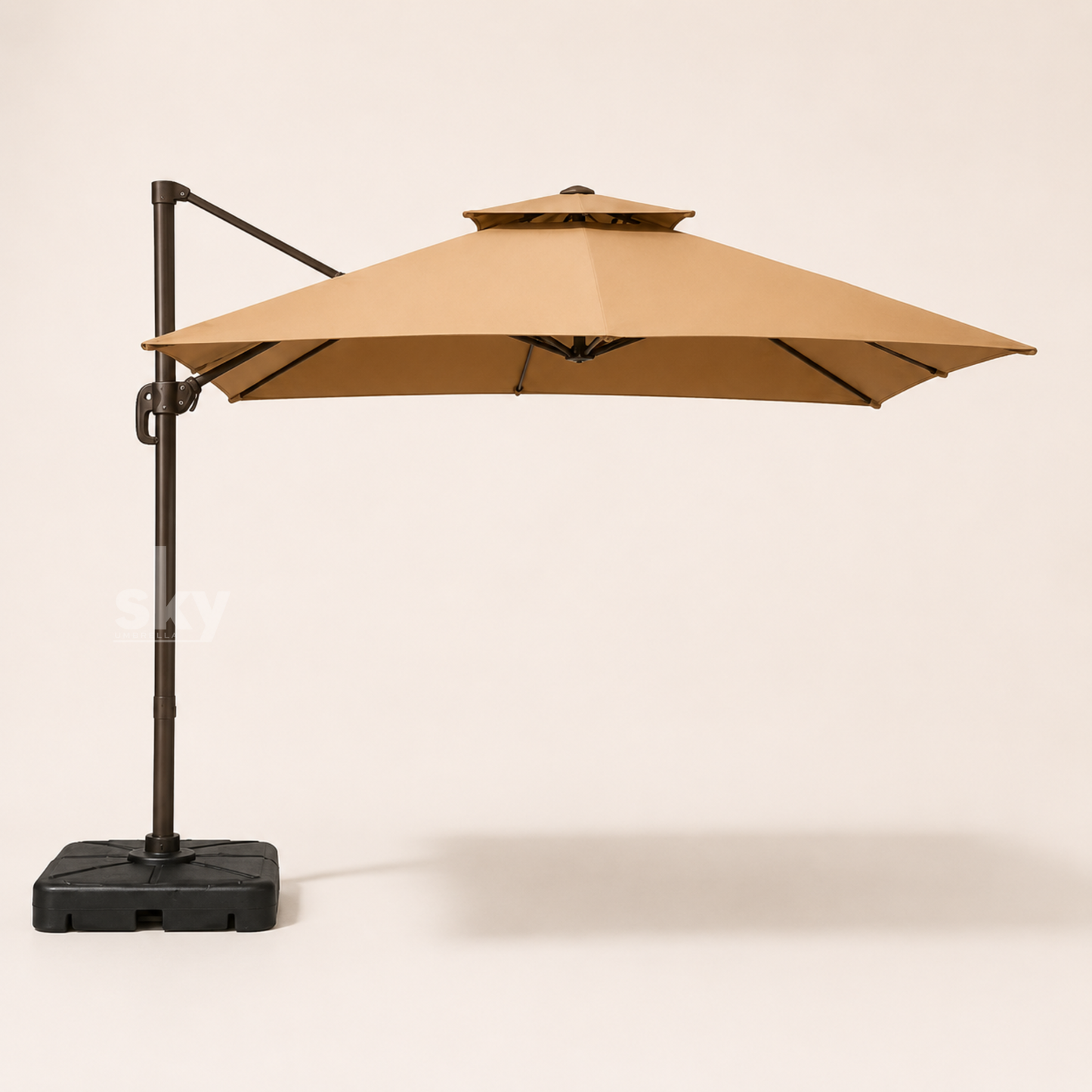 A Khaki double top Deluxe Square patio umbrella with a black metal pole and base, shown against a plain off-white background. 