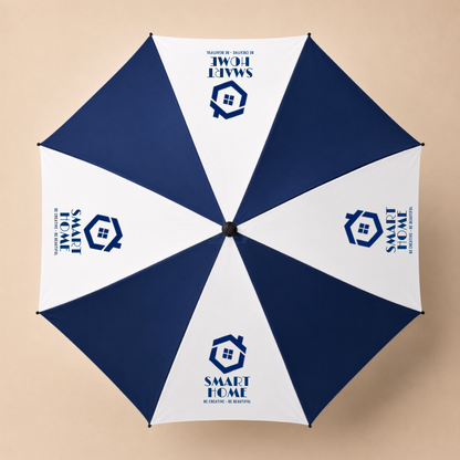 A top-down view of a golf umbrella with alternating navy blue and white panels, featuring a 'SMART HOME ACADEMIC AID SOCIETY' logo printed on the white panels.