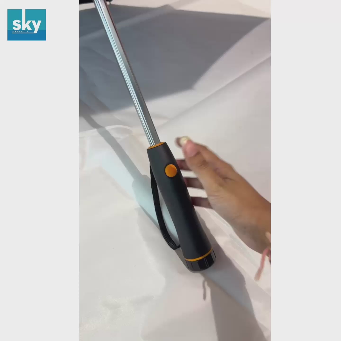A video Showing how the Fan Umbrella Works. Click on the orange button on the handle to use the Fan 